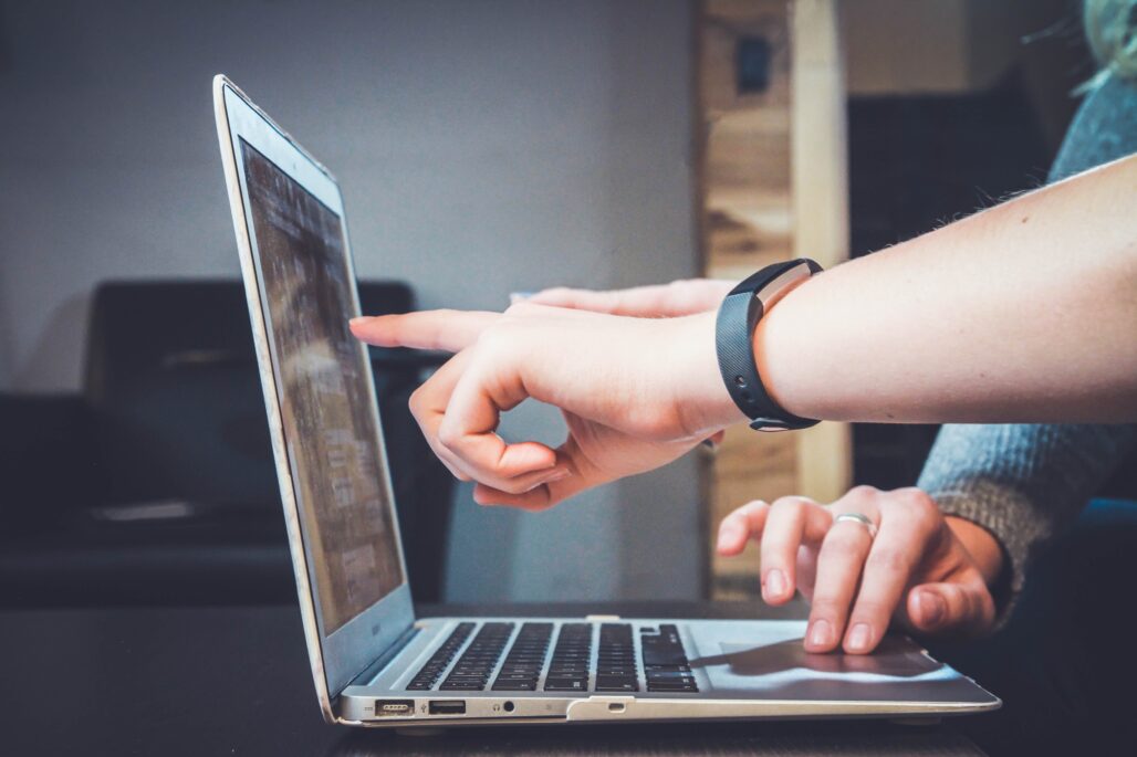 IT Resilience- Hand pointing to laptop screen